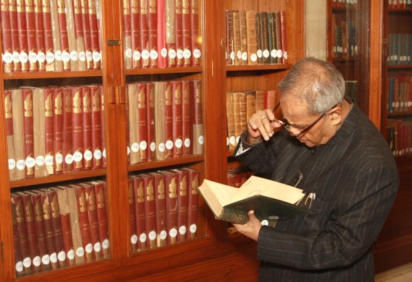 Pranab Mukherjee checks out old volumes in the library